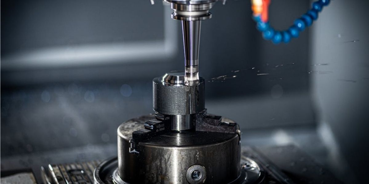 5-axis CNC machining operation — precision spindle and tool holder at VNcontX manufacturing facility Ho Chi Minh City Vietnam