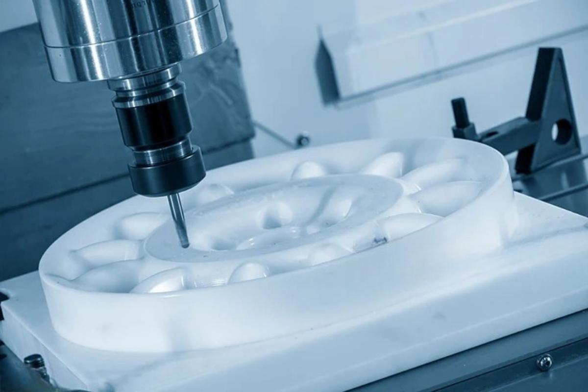 CNC plastic machining Vietnam — milling white engineering plastic block with precision spindle, VNcontX HCMC
