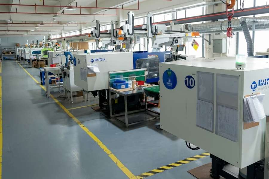 Injection molding machine production floor — VNcontX, Ho Chi Minh City, Vietnam