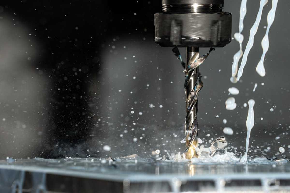 Stainless steel CNC drilling with coolant flood — precision machined at VNcontX Ho Chi Minh City Vietnam, ±0.005mm tolerance